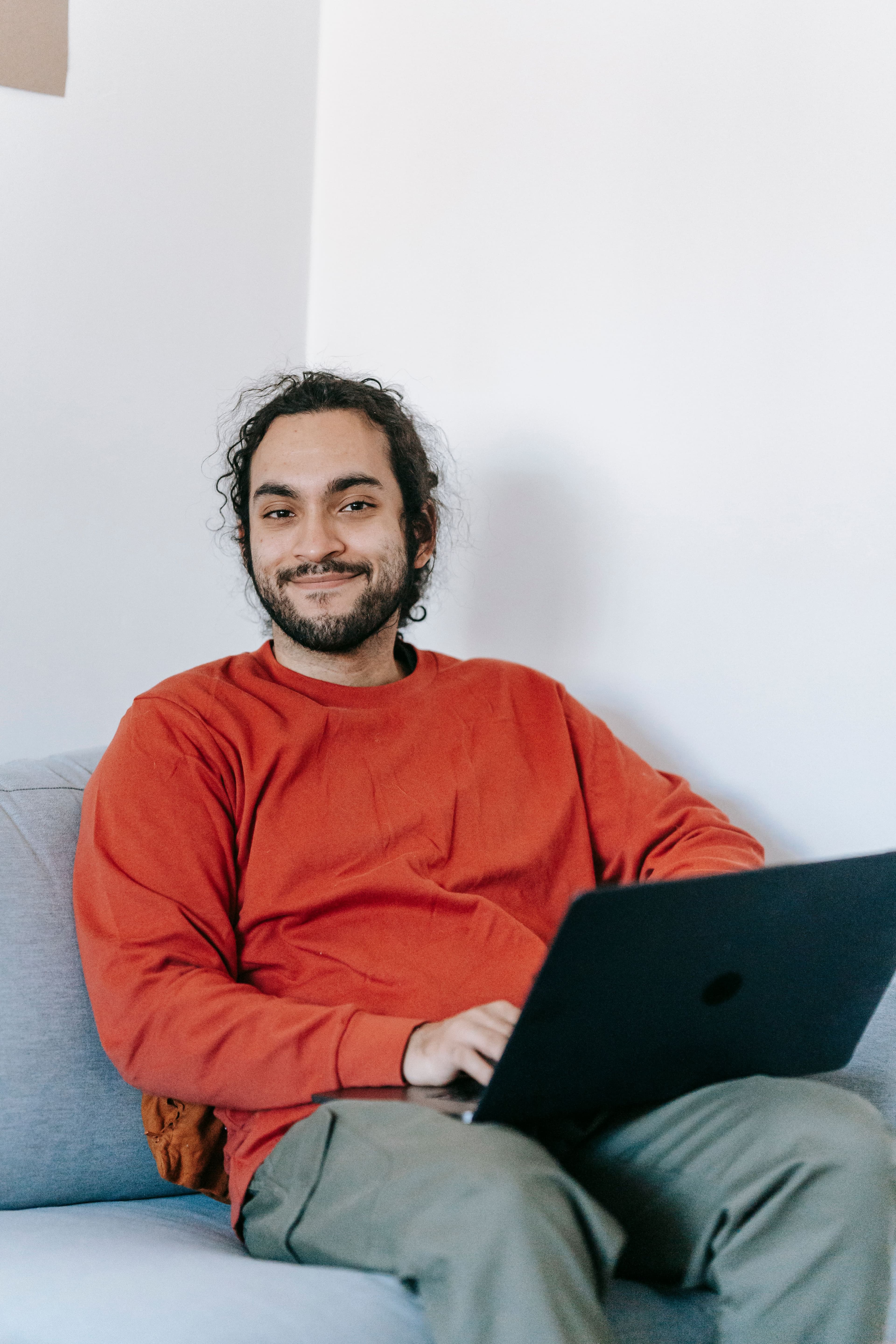 Entrepreneur smiling with a laptop